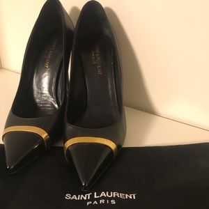 YSL black with gold toe pumps.